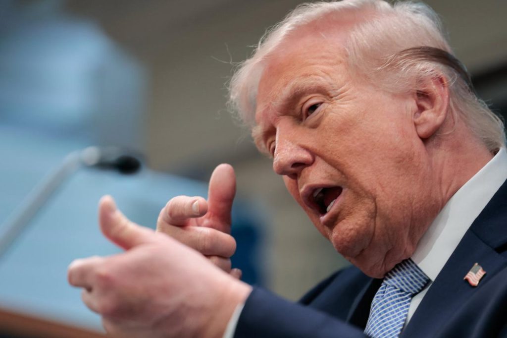 US President Donald Trump mimics firing a gun as he speaks about the conflict in Iran in the James S. Brady Press Briefing Room of the White House on April 6, 2026, in Washington, DC.